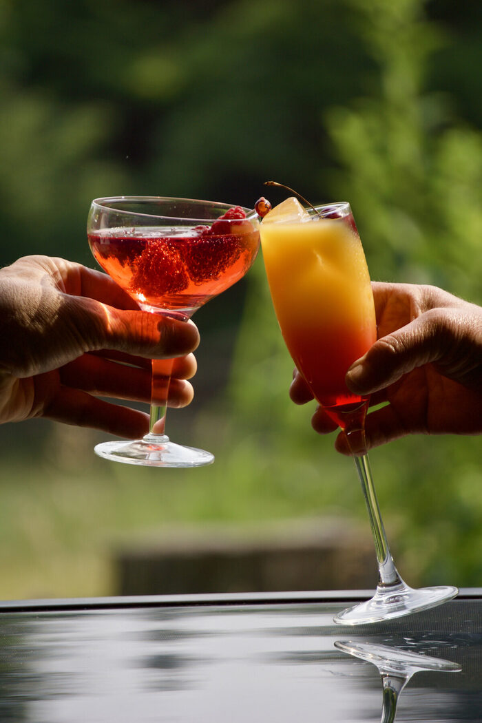 Two glasses raised in a toast